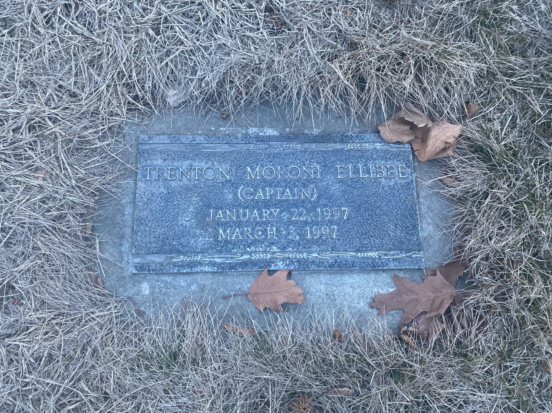 Bronze flat marker plaque before cleaning