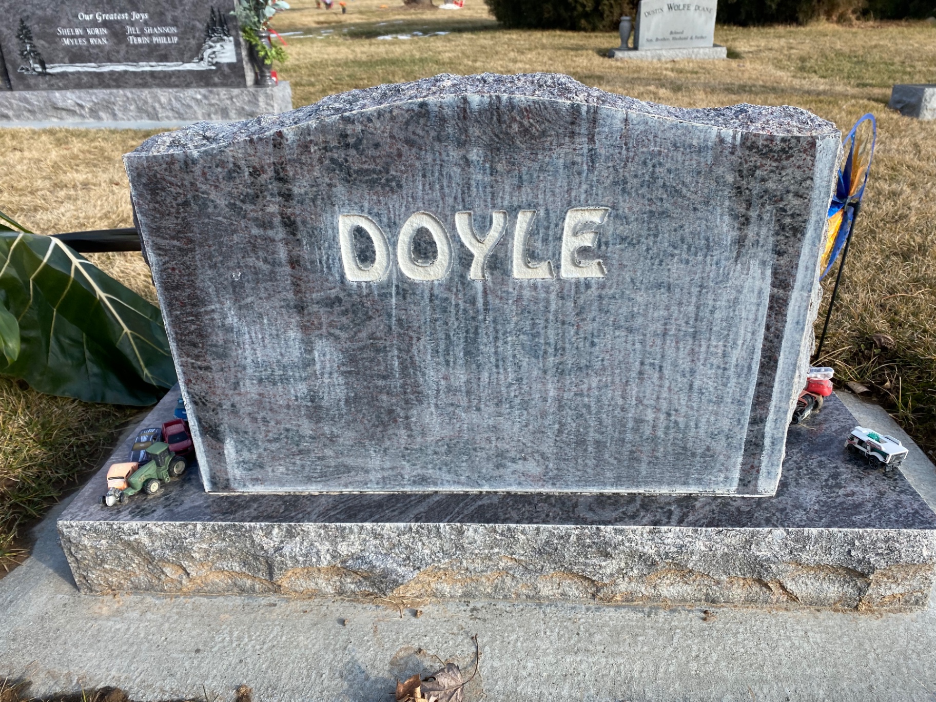 Weathered upright monument before cleaning