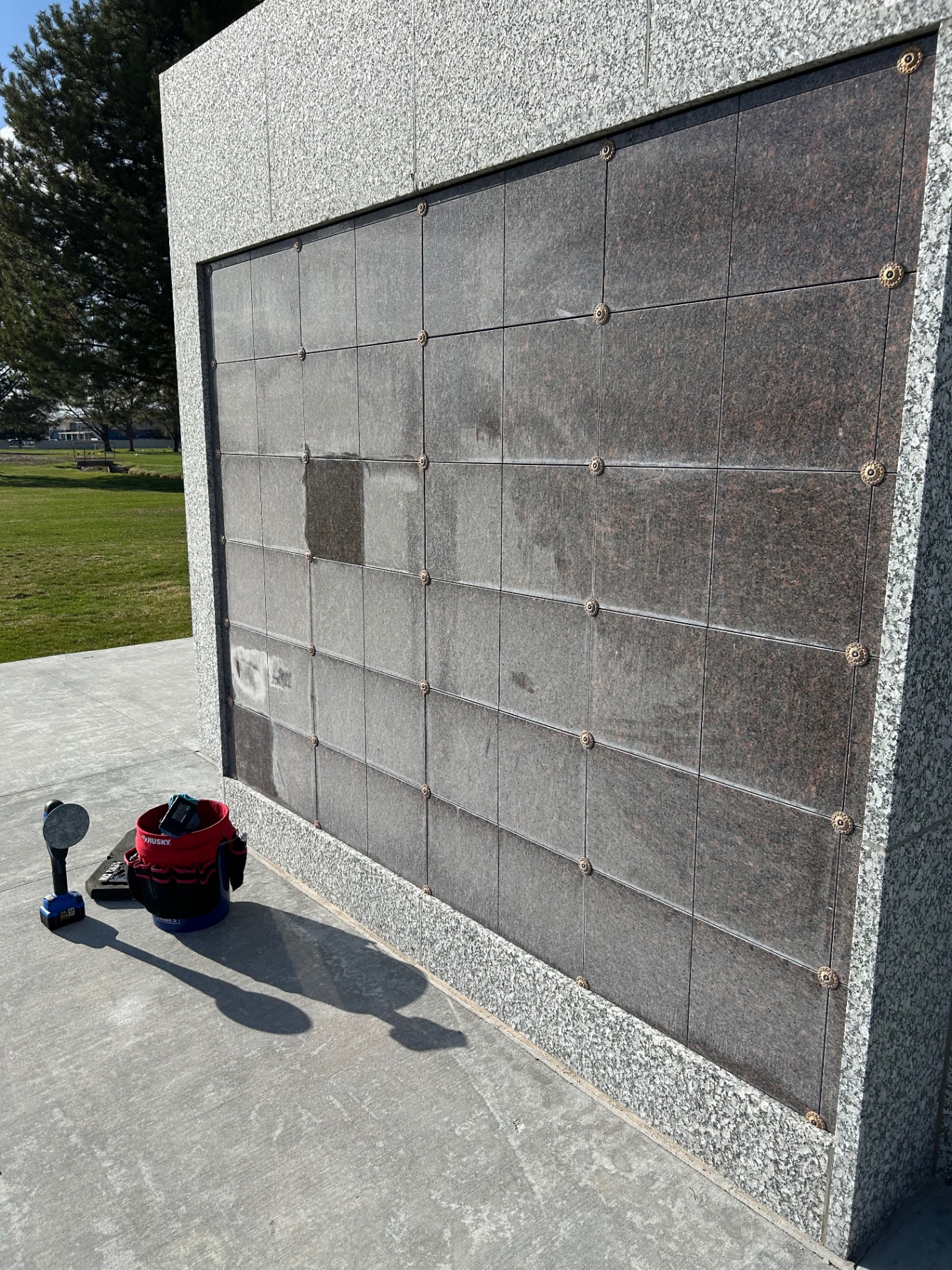 Weathered columbarium wall before cleaning