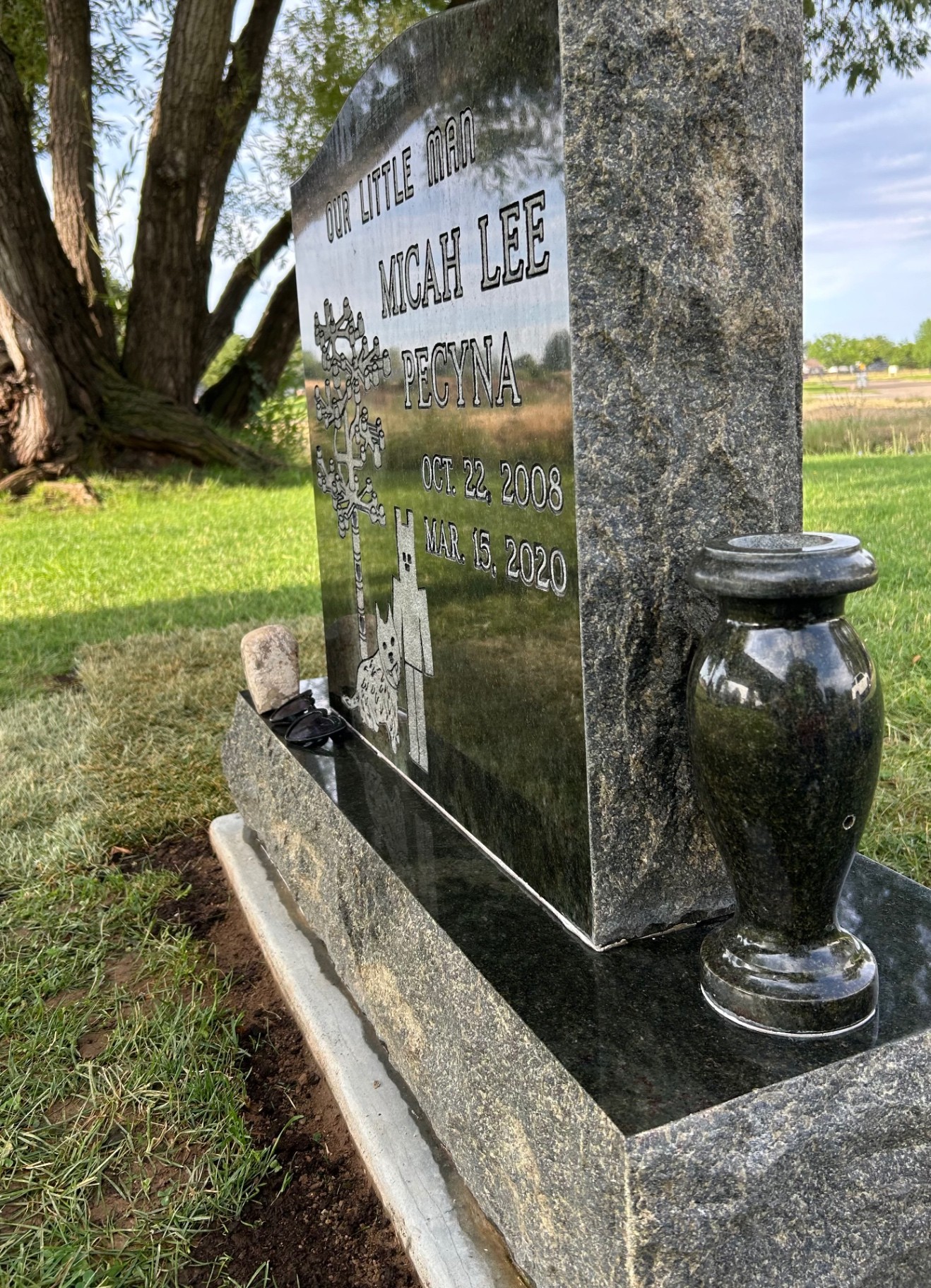 Single upright headstone after cleaning